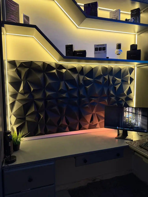 Black 3D foam wall panels covering a wall behind a desk