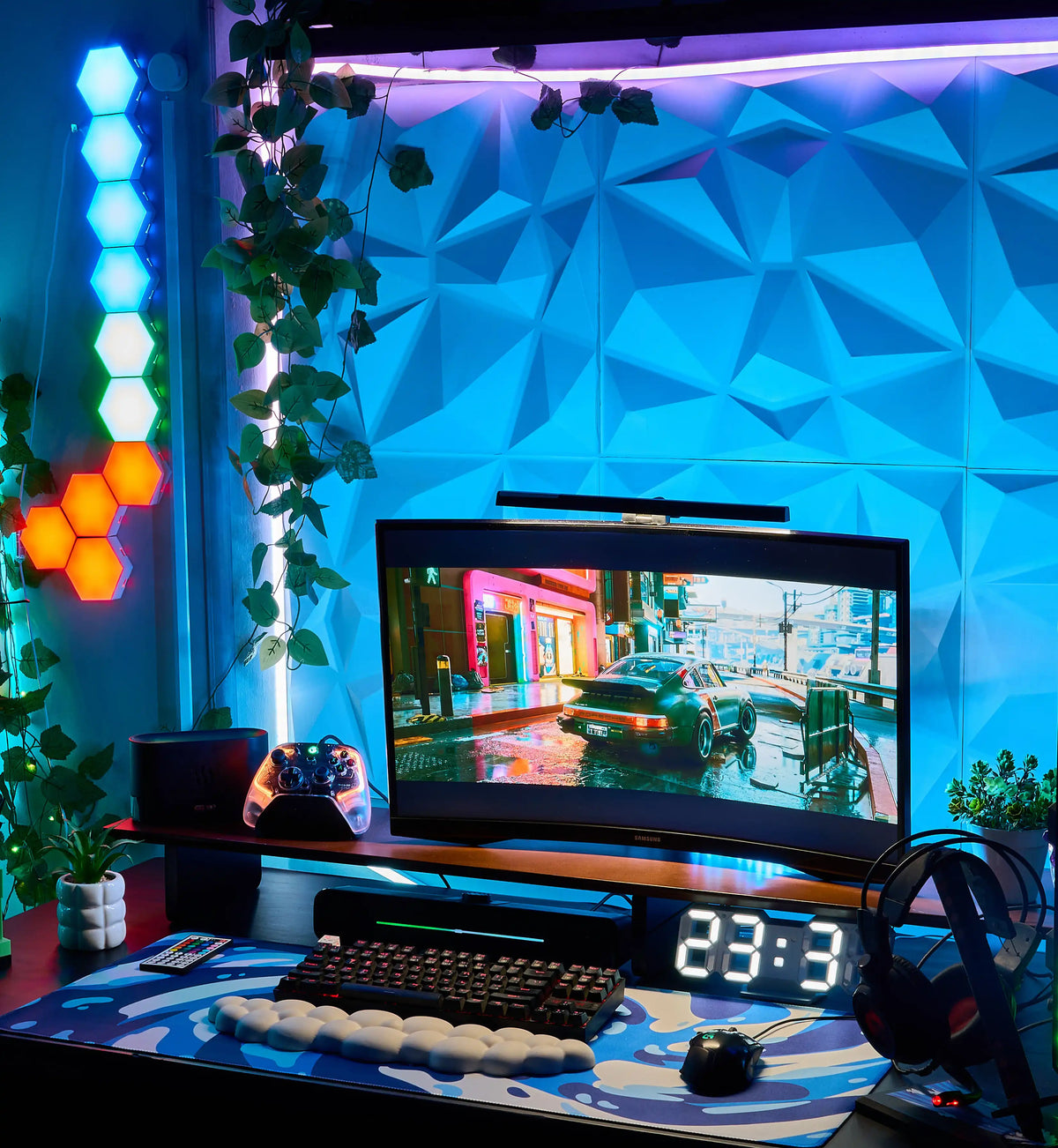 Example gaming desk setup with a white RGB pegboard, wall shelf and plants in warm lighting