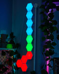 Hexagon and triangle nano light panels glowing on a wall