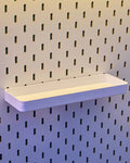 Pegboard shelf containers: a deep cup holder and a display ledge